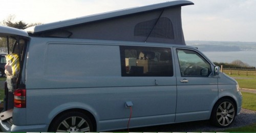 A VW T5 Campervan called BabyBlueT5 and The vans left side full view! for hire 