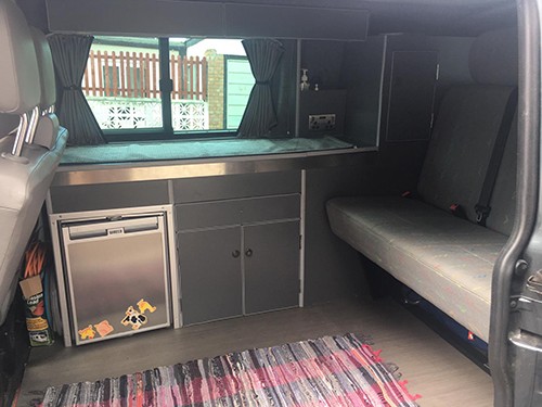 A VW T5 Campervan called Rosie and Interior, including fridge freezer, sink and hob unit, storage and Rock N Roll Bed (Smart Evolution 2) for hire in South Croydon, Surrey