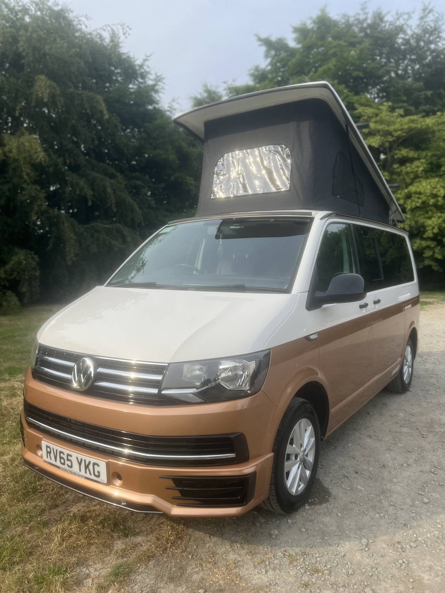 A VW T6 Campervan called Snug-Dub and Front - Showing WestDubs Pop up Roof for hire 