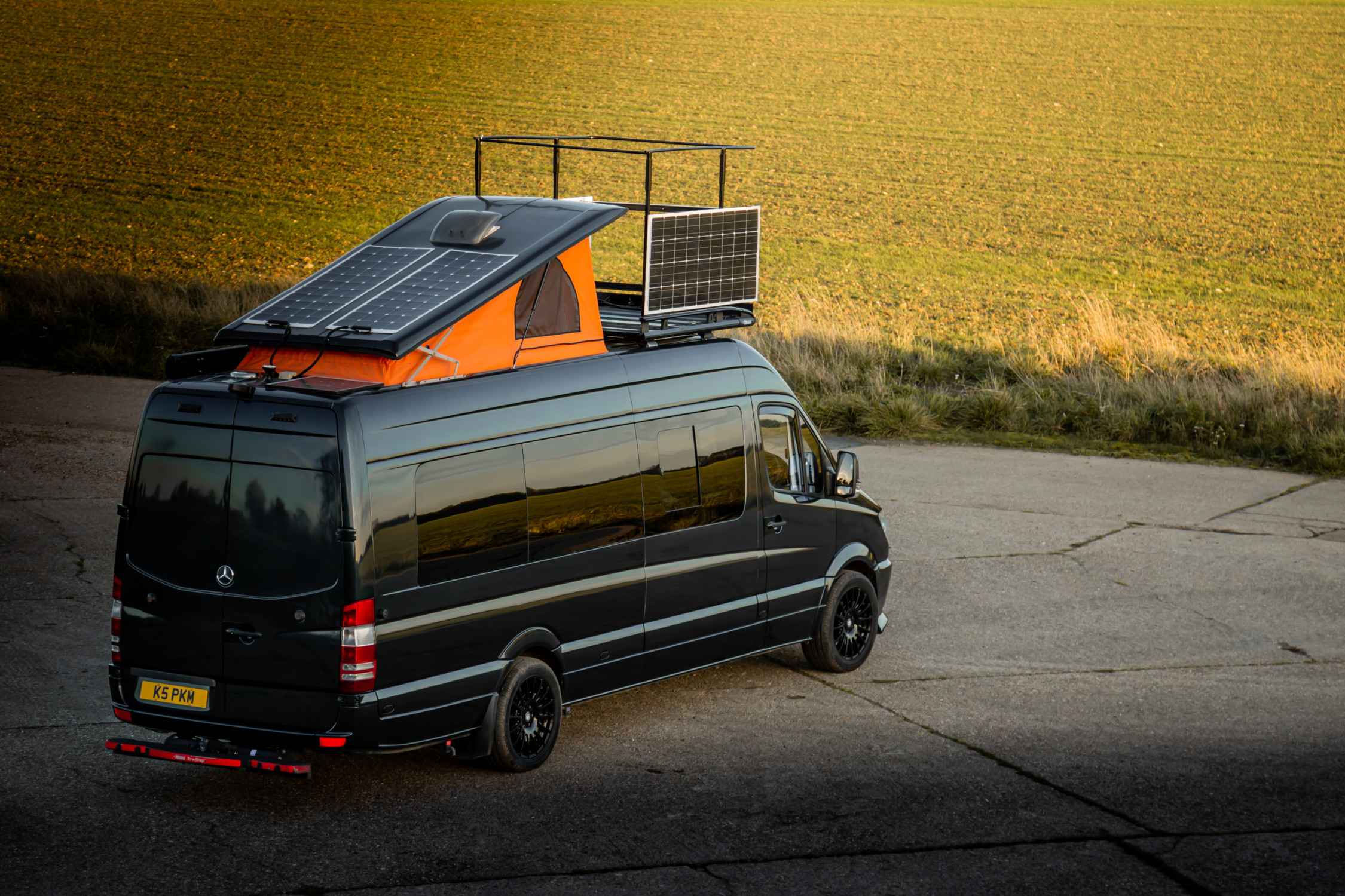 A Mercedes Sprinter Campervan called Black-Prince and Pop Top Roof with viewing platform raised. for hire in Diss, England