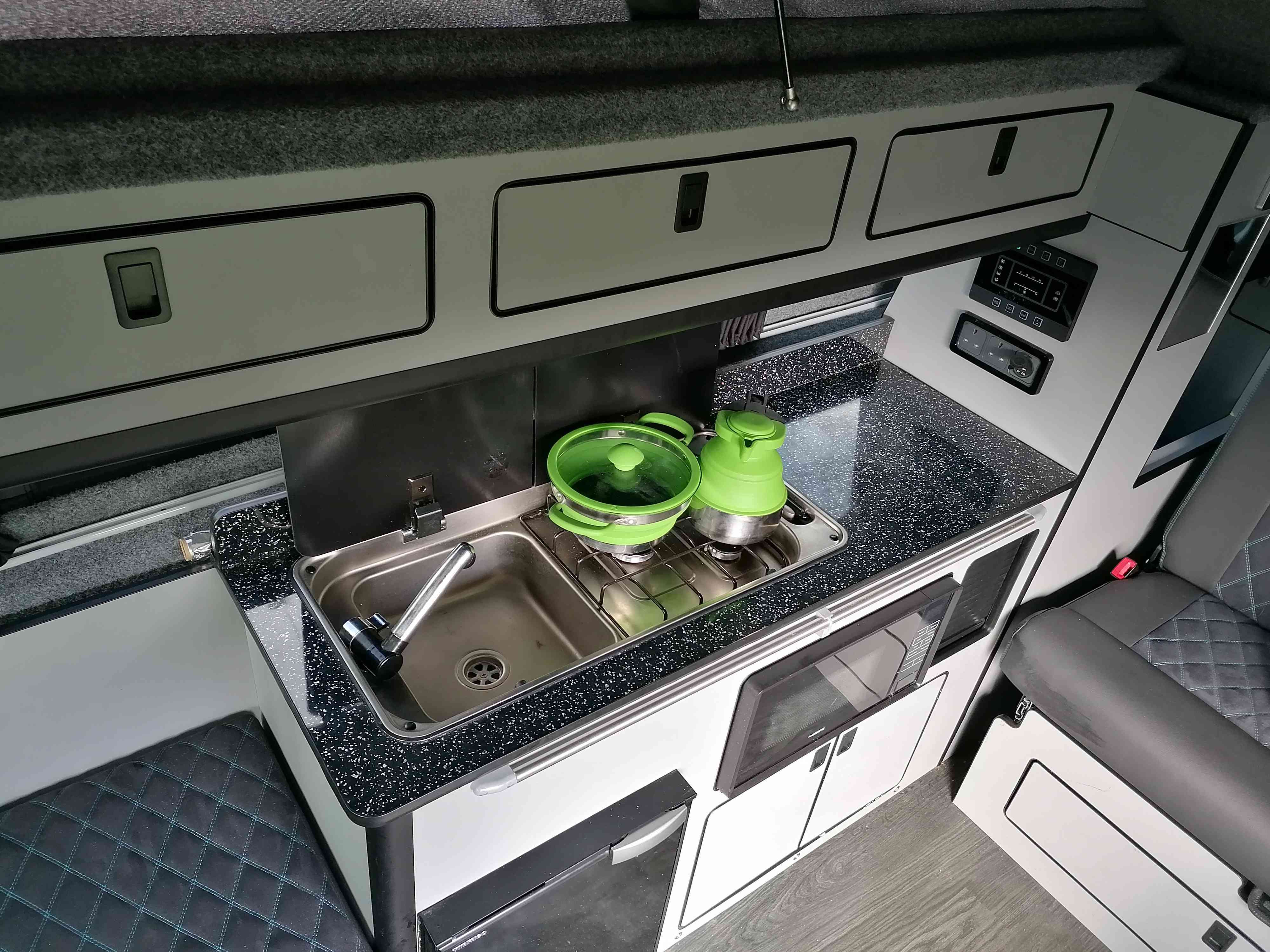 A Ford Campervan called Joyride and It has a sink and 2-burner hob with extractor fan. for hire in Walsall, West Midlands