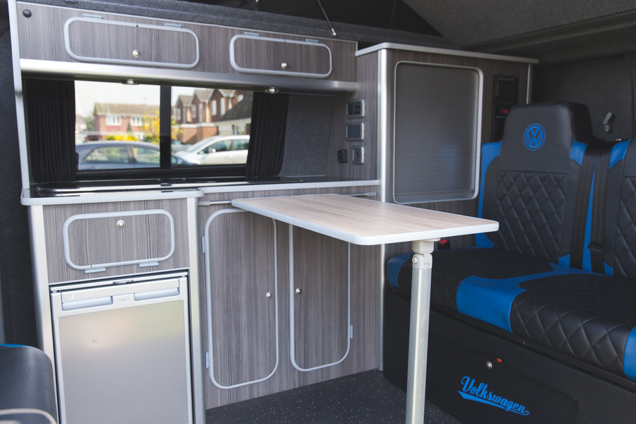 A VW T5 Campervan called Odie and Living area with table for hire in Sittingbourne, Kent