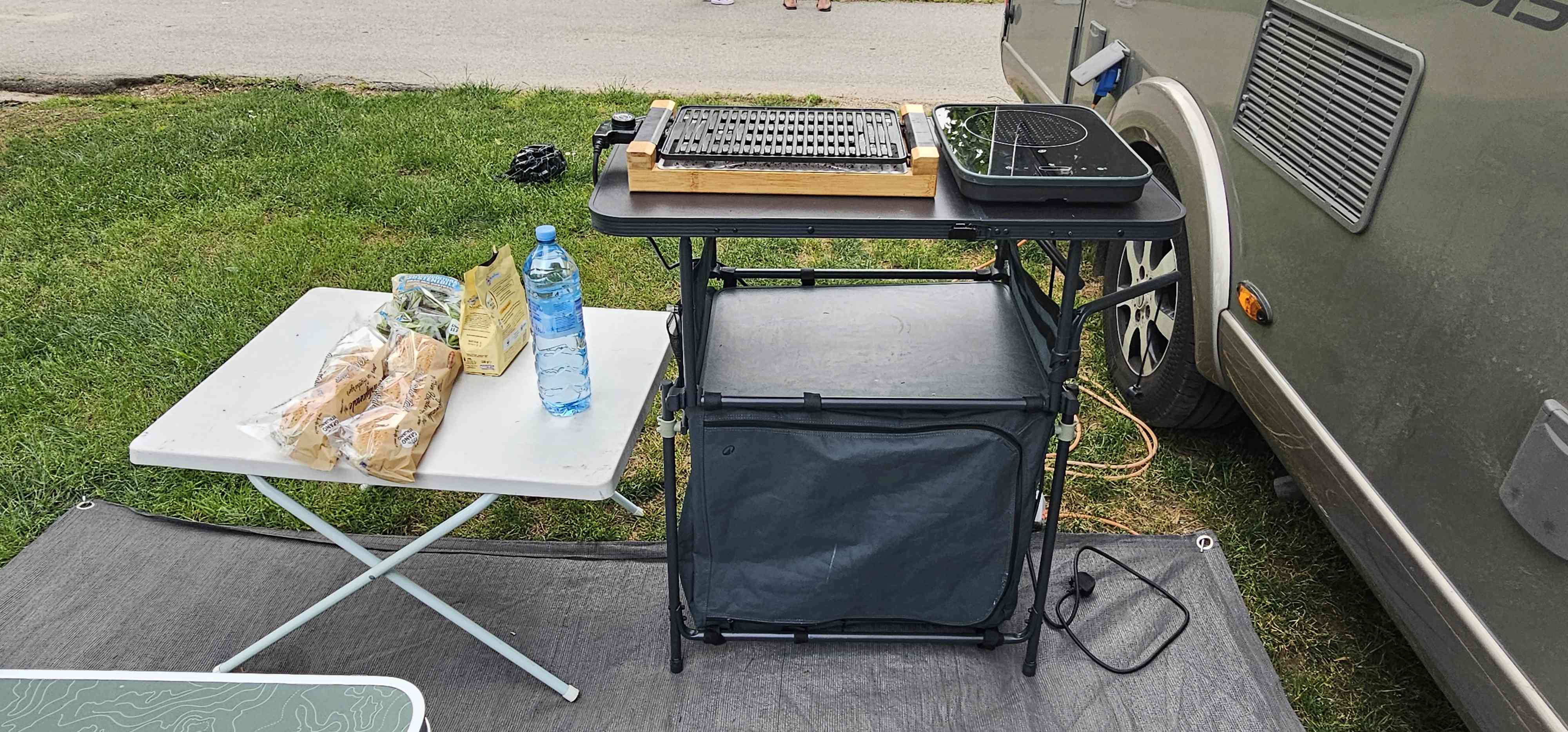 A Hymer Motorhome called Ellen-Mae and Electric grill, outdoor kitchen, induction hob, tables, chairs and floor mats are all included for hire 