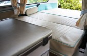 A VW T2 Classic campervan called Harvey and The bench seat pulls out to make the full-width double bed for hire in Witham, Essex