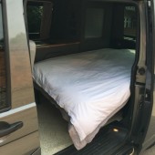 A VW T5 Campervan called Maple and Night setup for hire 