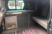 Interior, including fridge freezer, sink and hob unit, storage and Rock N Roll Bed (Smart Evolution 2)