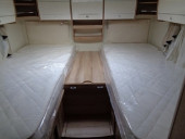 Two fixed beds which turn into a double.