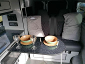 A Ford Campervan called Joyride and The table can slide to differnt positions, for on-board dining or family games, when the passenger seats are swiveled backwards. for hire in Walsall, West Midlands