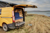 A Ford Campervan called Bumblebee and Rear facing seats to enjoy a drink with a view under the tailgate for hire in Stromness, Orkney Islands